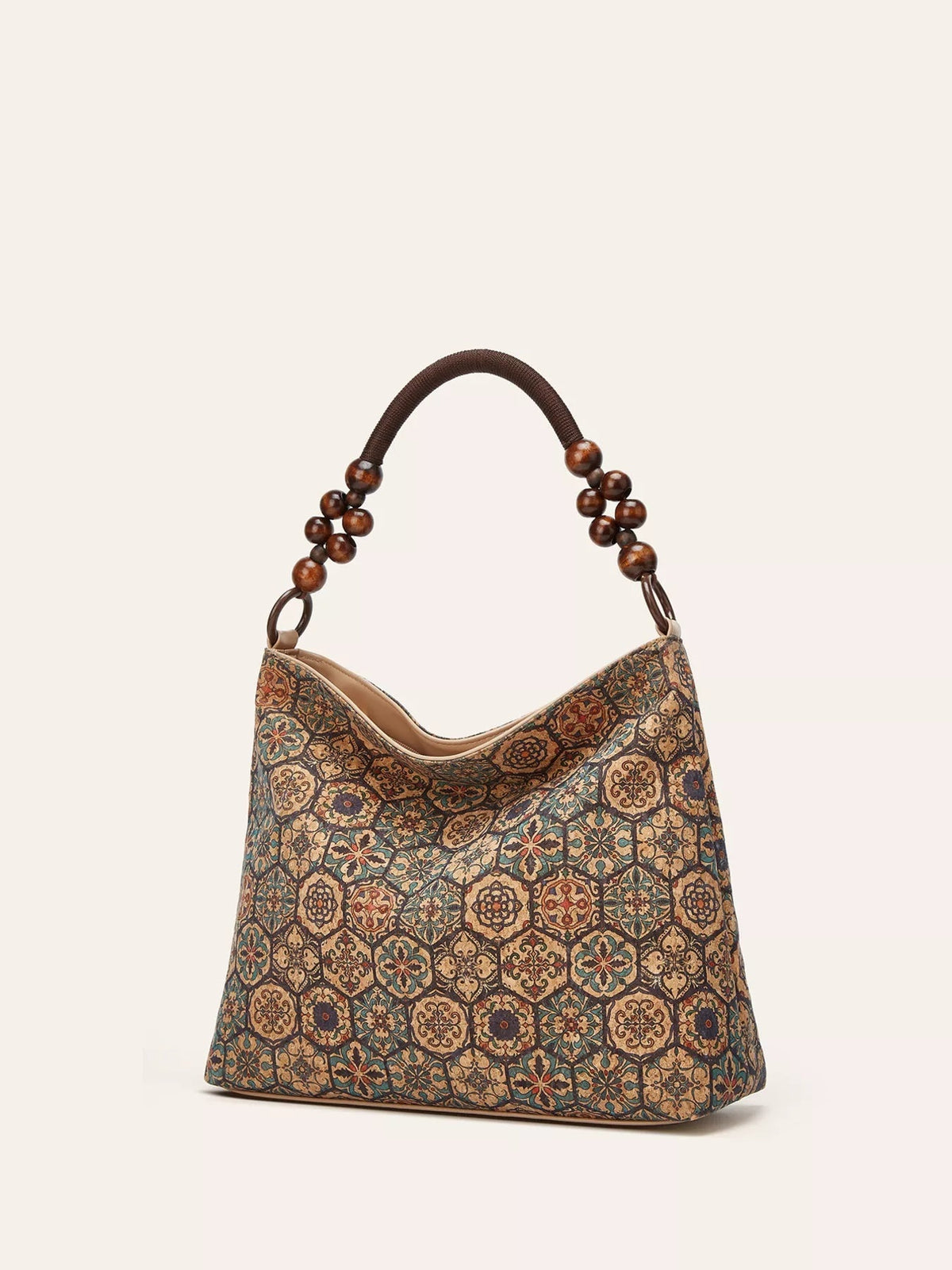A medium PU leather hobo handbag with a slouchy silhouette, ornate geometric pattern in teal, tan, and brown, and a dark wooden-bead handle.
