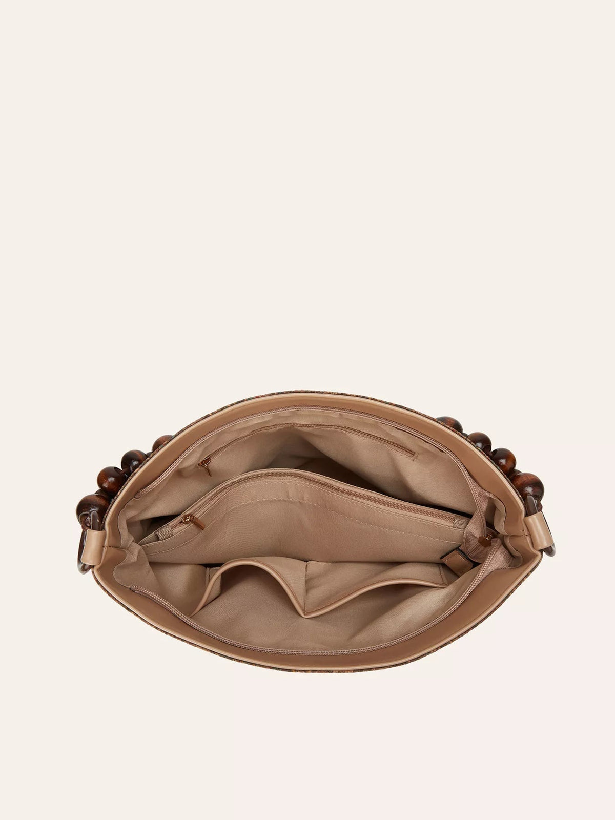 Open medium PU leather hobo handbag reveals a spacious beige lining with multiple compartments, interior zip pockets, and a structured rounded silhouette.