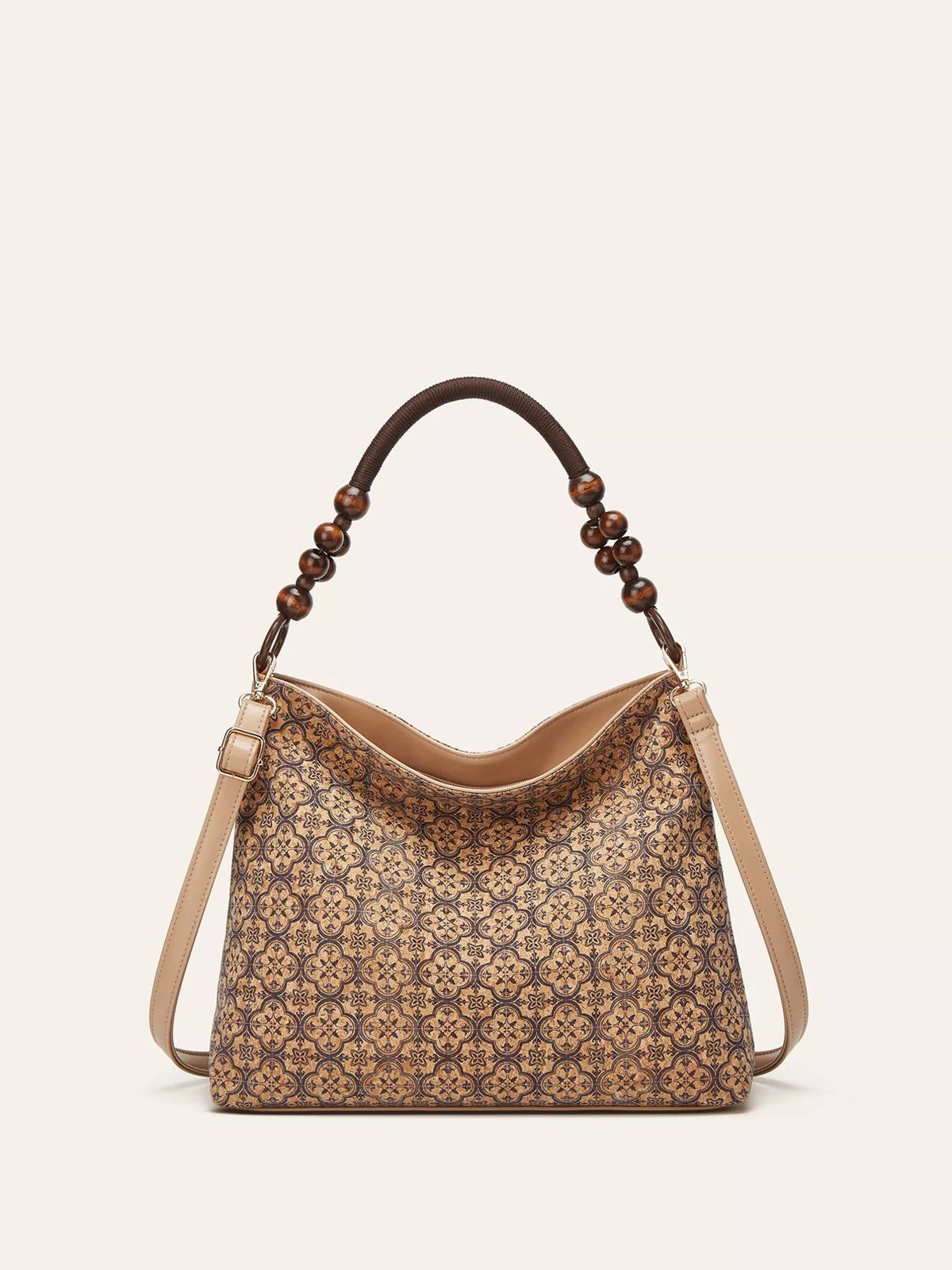 Medium bohemian geometric-pattern hobo handbag in tan PU leather, featuring a slouchy silhouette, curved top, beaded handle, and detachable shoulder straps.