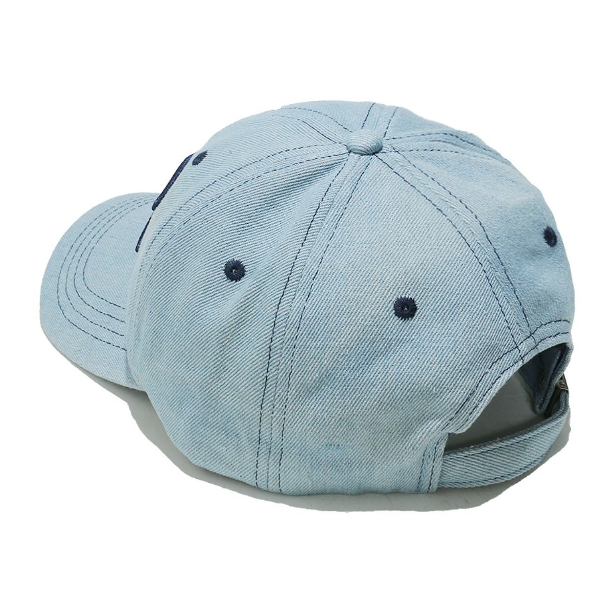 Light blue denim cotton baseball cap with a six-panel crown, curved brim, contrast topstitching, ventilation eyelets, and an adjustable back strap.
