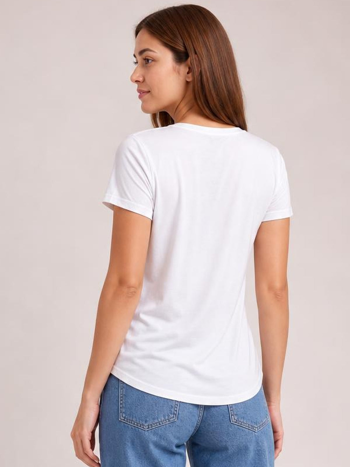 Model shown from the back in a white round-neck short-sleeve T-shirt with a straight, relaxed silhouette, smooth opaque fabric, and curved hem.