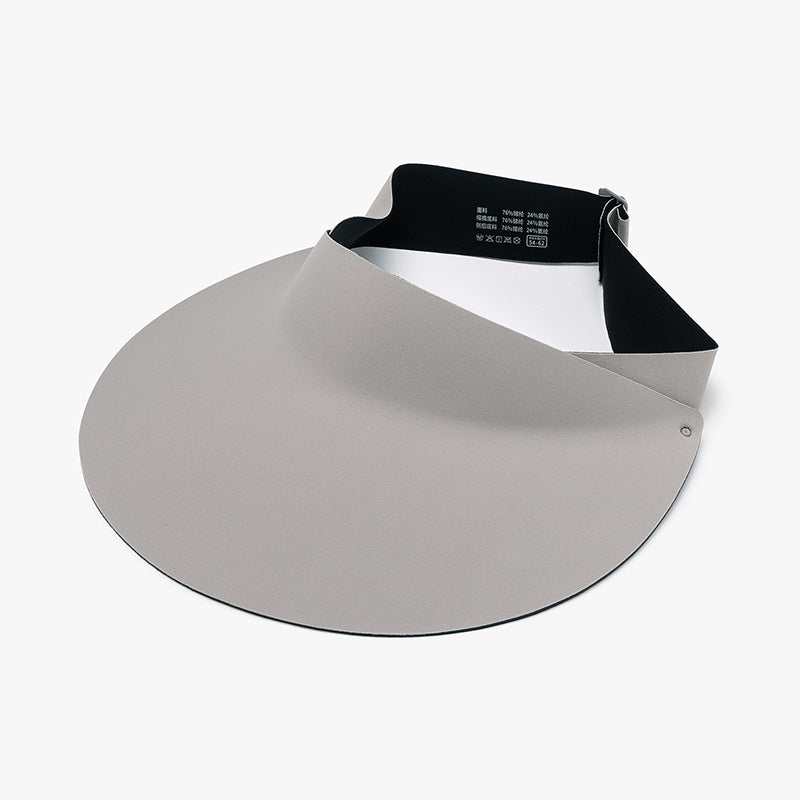 Light gray breathable sun hat with a sleek open-crown visor silhouette, wide softly curved brim, and black adjustable back strap.