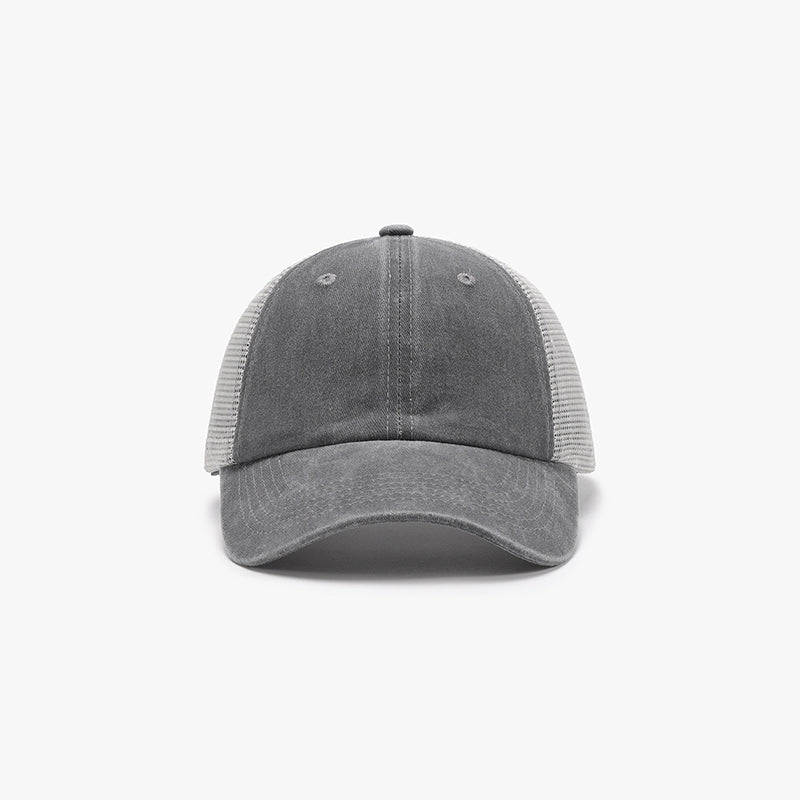Gray breathable mesh baseball cap with a structured six-panel front, airy side panels, center seam, ventilation eyelets, and a gently curved brim.