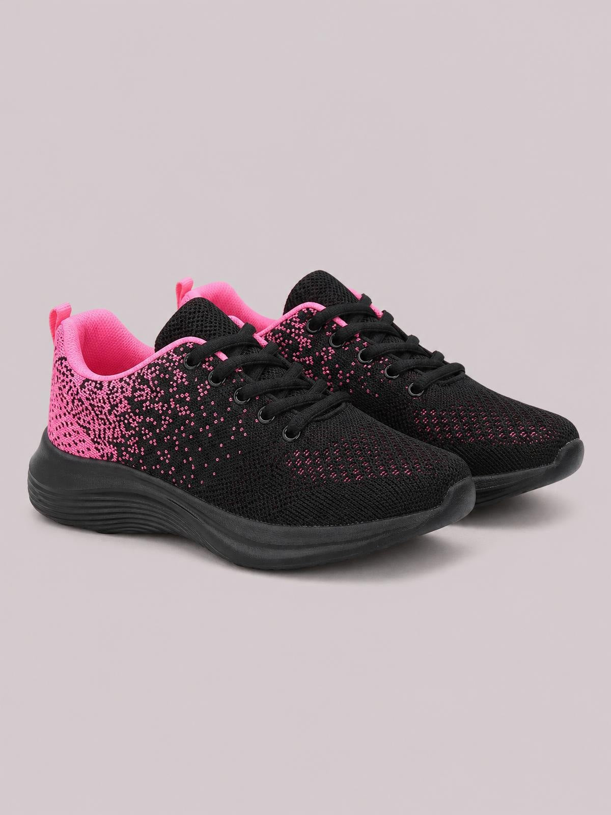 Black and pink breathable mesh athletic sneakers feature round toes, lace-up fronts, padded collars, and sturdy flat rubber soles.