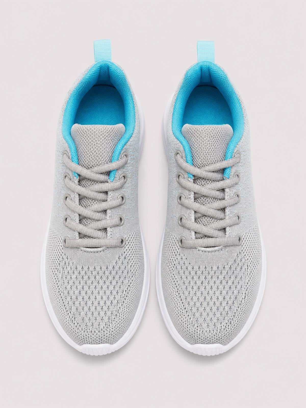 A pair of gray breathable mesh round-toe athletic sneakers features lace-up construction, bright turquoise lining, and white rubber flat soles.