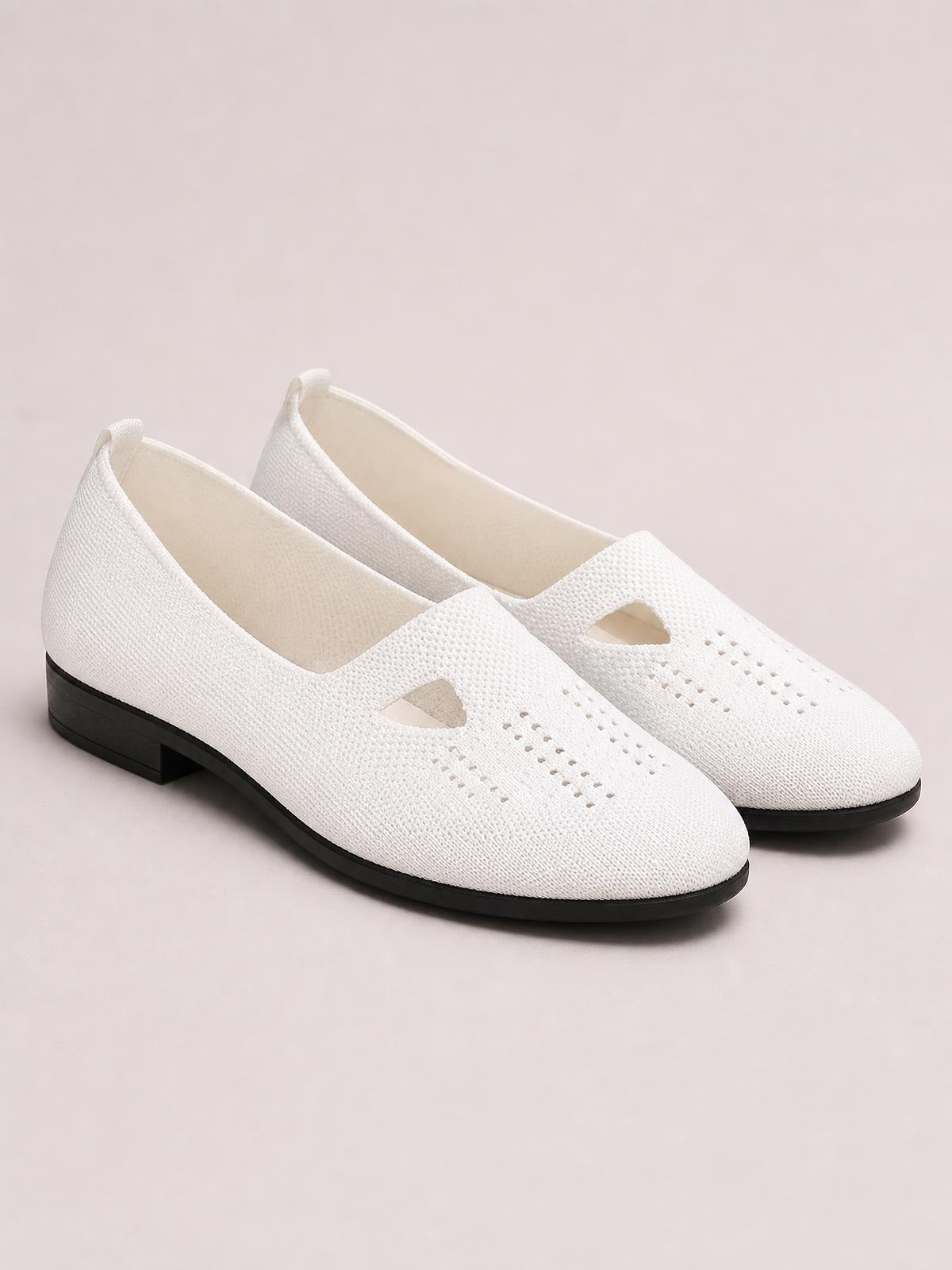 White breathable mesh round-toe flat slip-ons feature perforated uppers, side cutouts, easy slip-on styling, and contrasting black rubber soles.