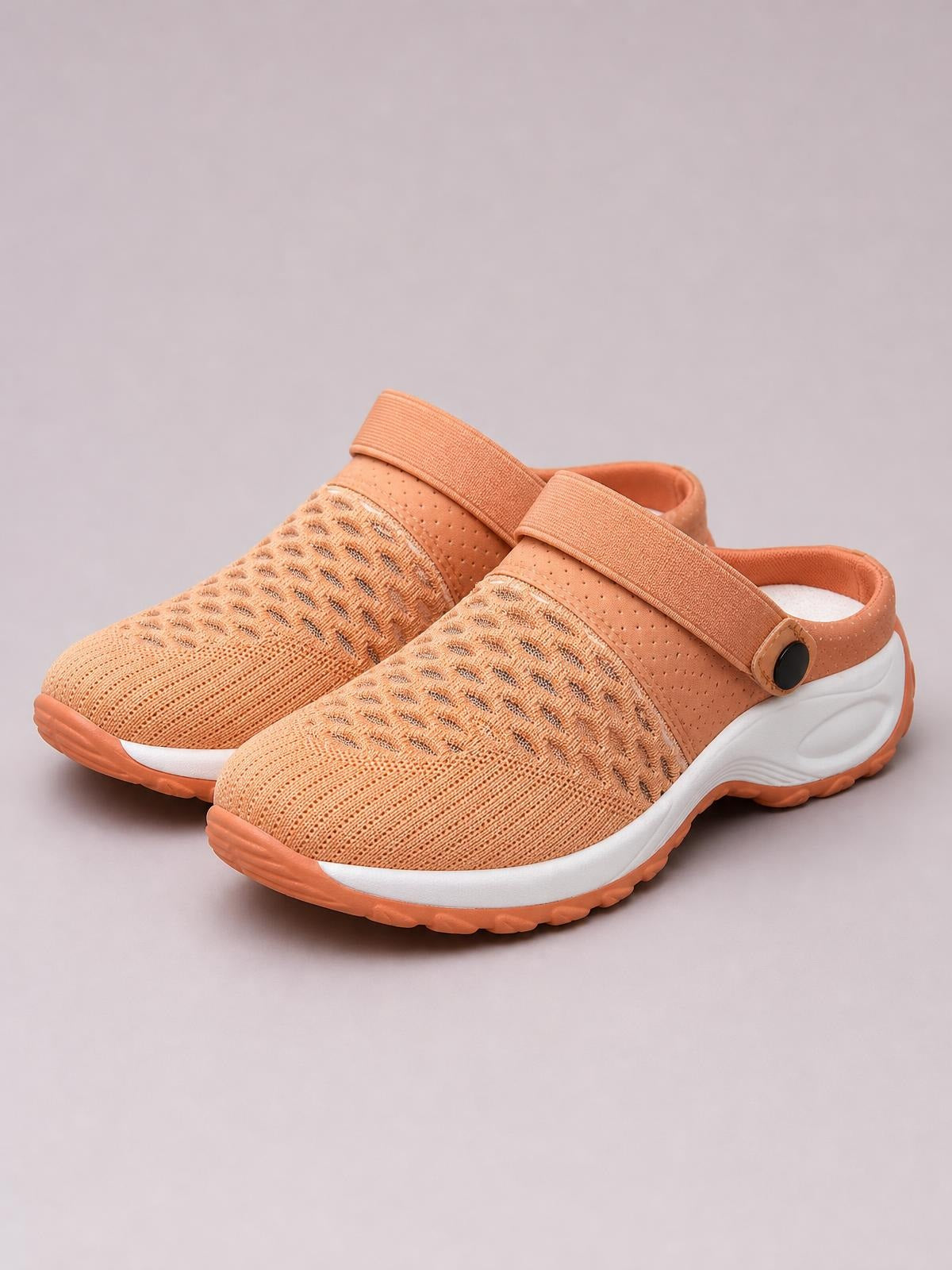 Peach breathable mesh sneakers feature rounded toes, wide adjustable strap closures, sculpted white midsoles, and textured rubber outsoles.