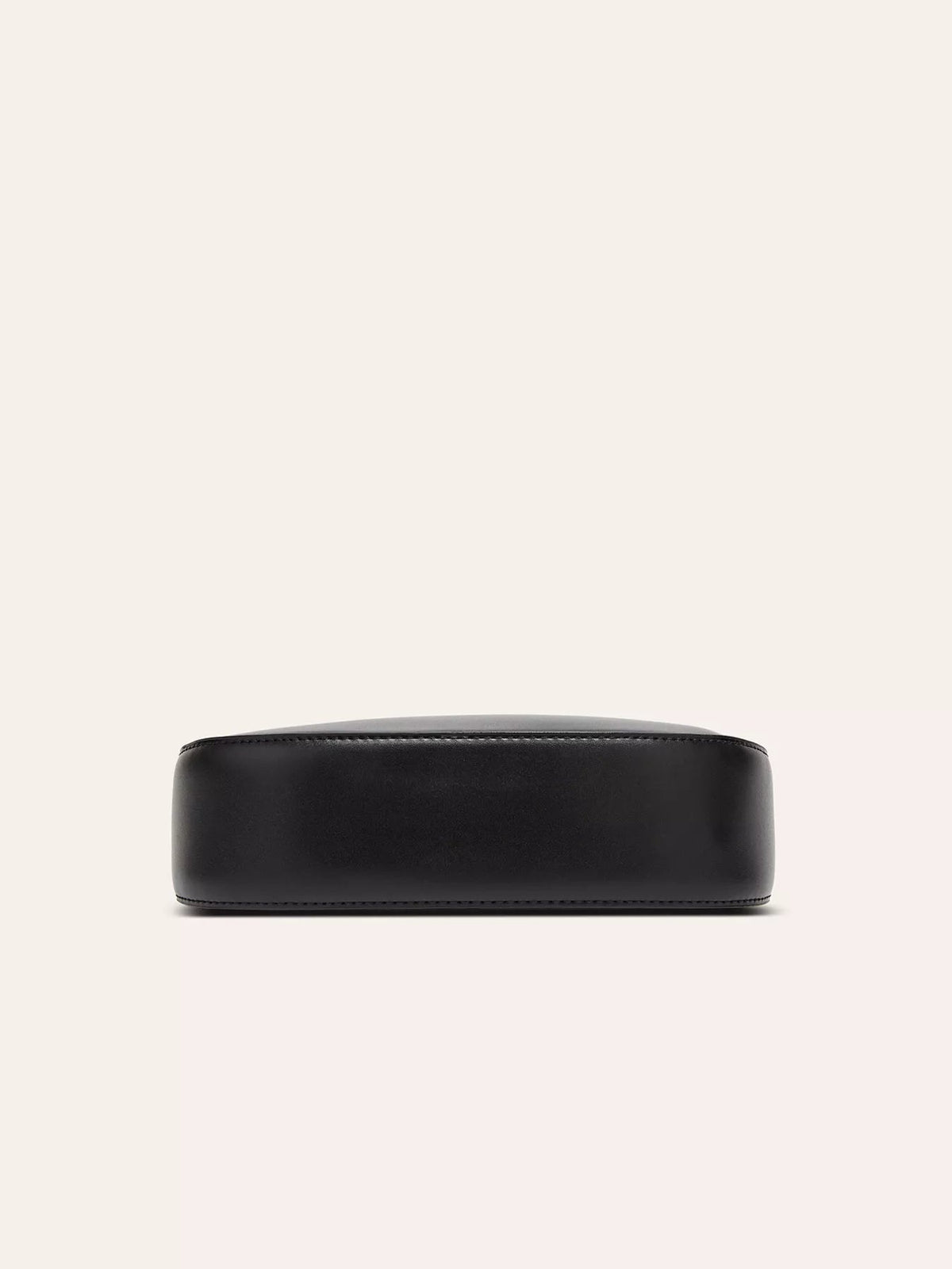 Small black PU leather shoulder bag shown from the front, featuring a sleek rounded-rectangular silhouette, smooth finish, and neat tonal edge stitching.