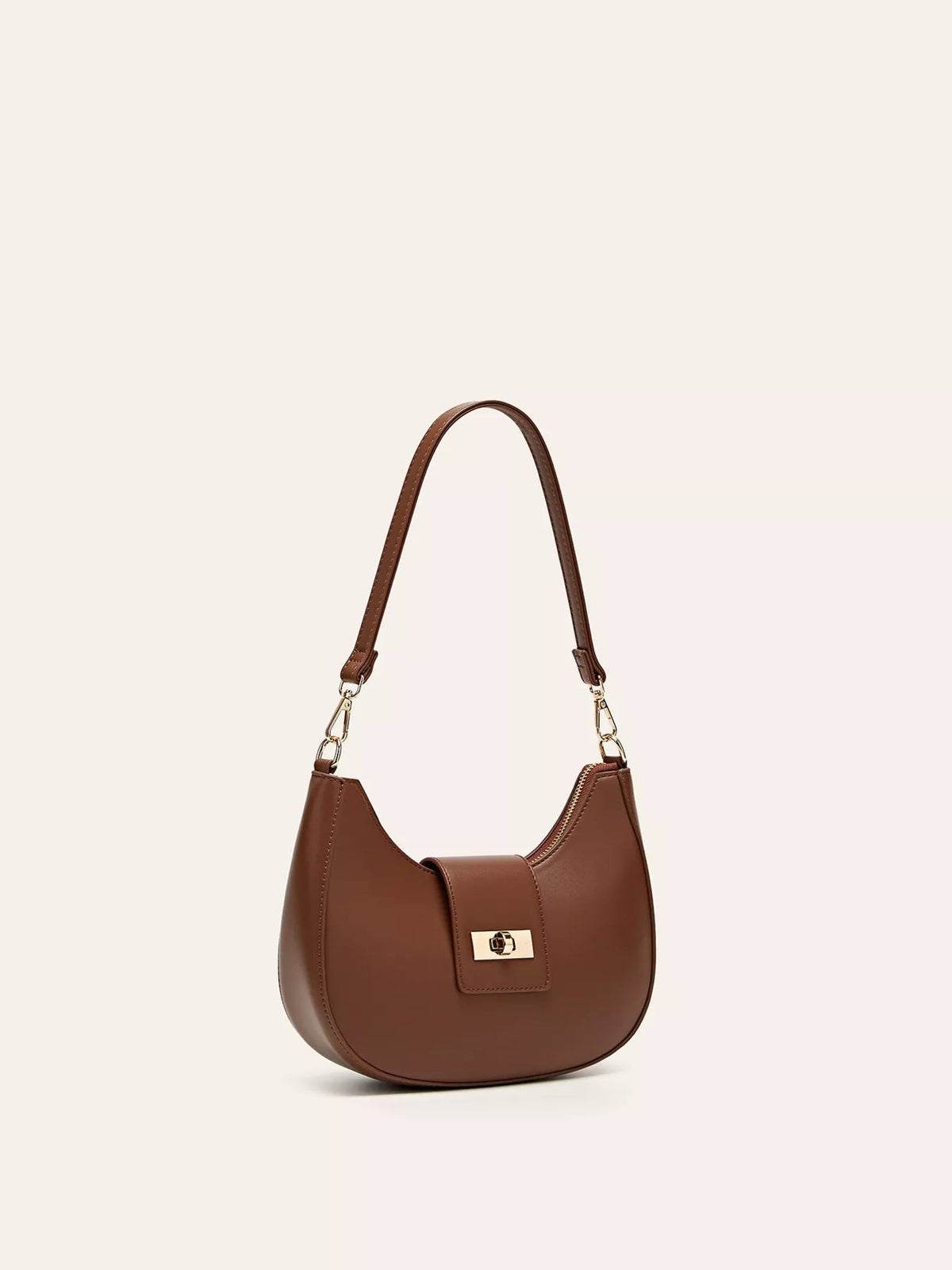 Small brown PU leather shoulder bag with a rounded silhouette, detachable strap, gold-tone hardware, zippered top, and front buckle closure.