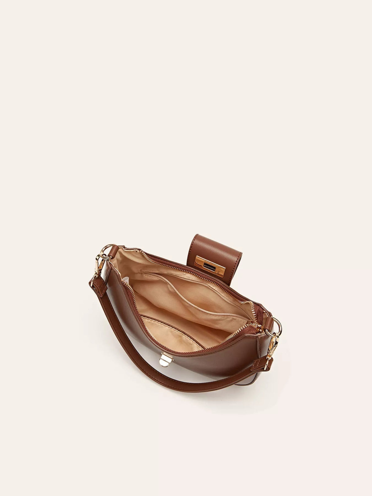 Small brown PU leather shoulder bag shown open, featuring a structured silhouette, adjustable strap, zippered compartments, and a buckle closure.