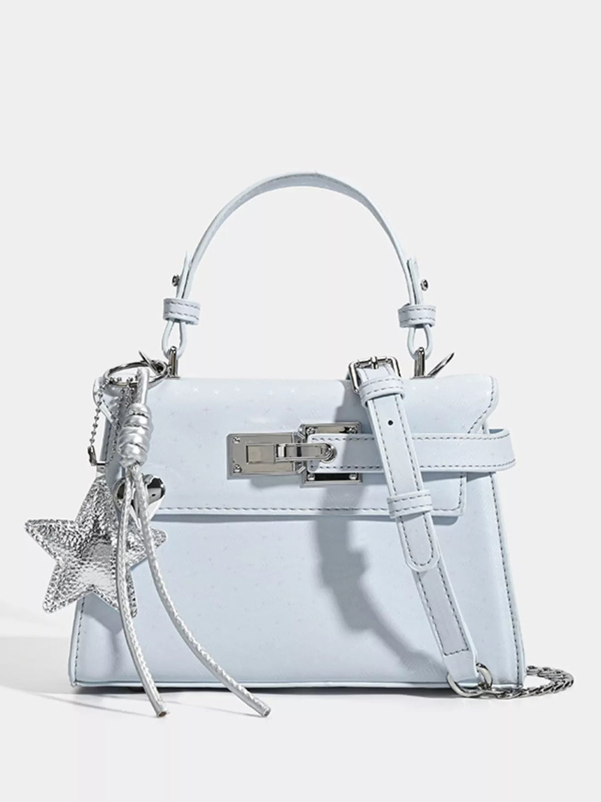 Mini light blue PU leather handbag with a structured silhouette, top handle, buckle-flap closure, silver hardware, star charm, and chain shoulder strap.