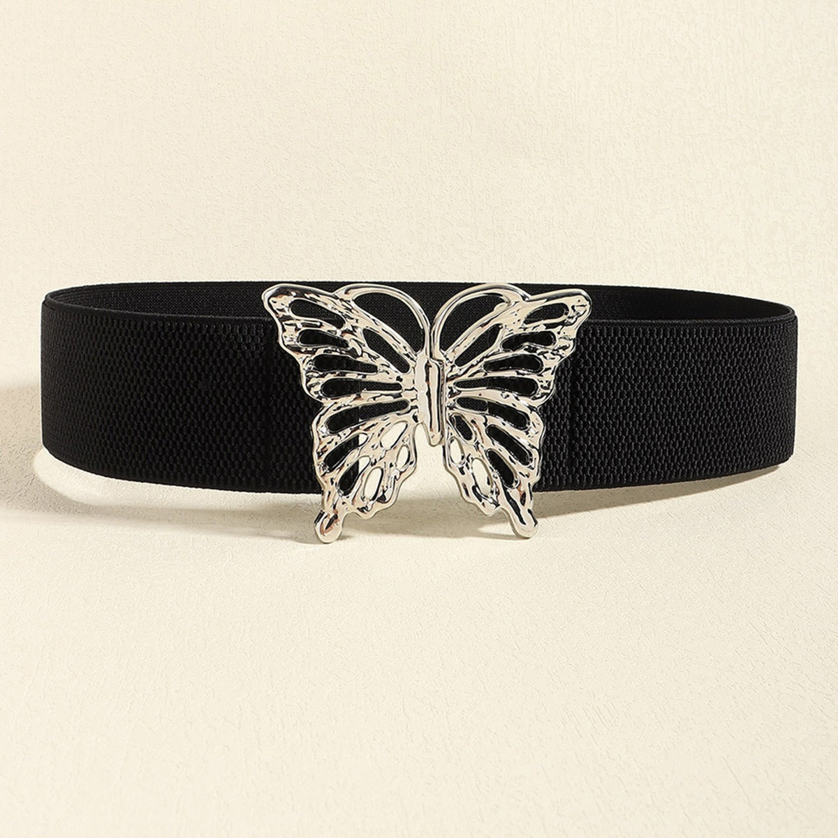 A wide black elastic belt features a polished silver-tone butterfly alloy buckle and textured woven band for a defined waist silhouette.