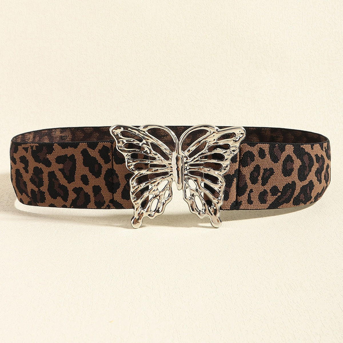 Wide leopard-print elastic belt with a polished silver alloy butterfly buckle, creating a bold, feminine waist-defining silhouette.
