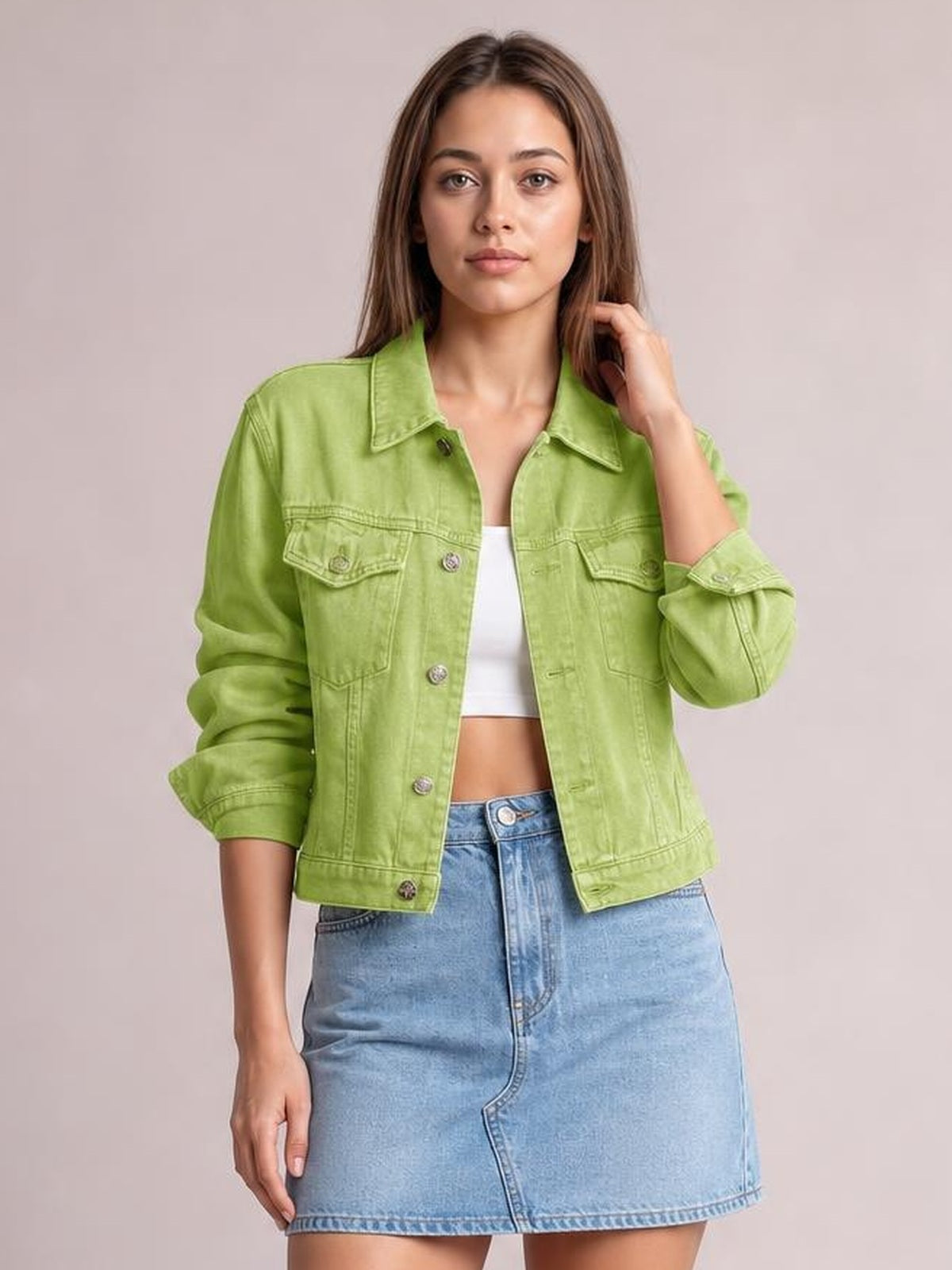 Model wears a lime green button-up long sleeve denim jacket with a collared neckline, chest flap pockets, straight silhouette, and rolled cuffs.