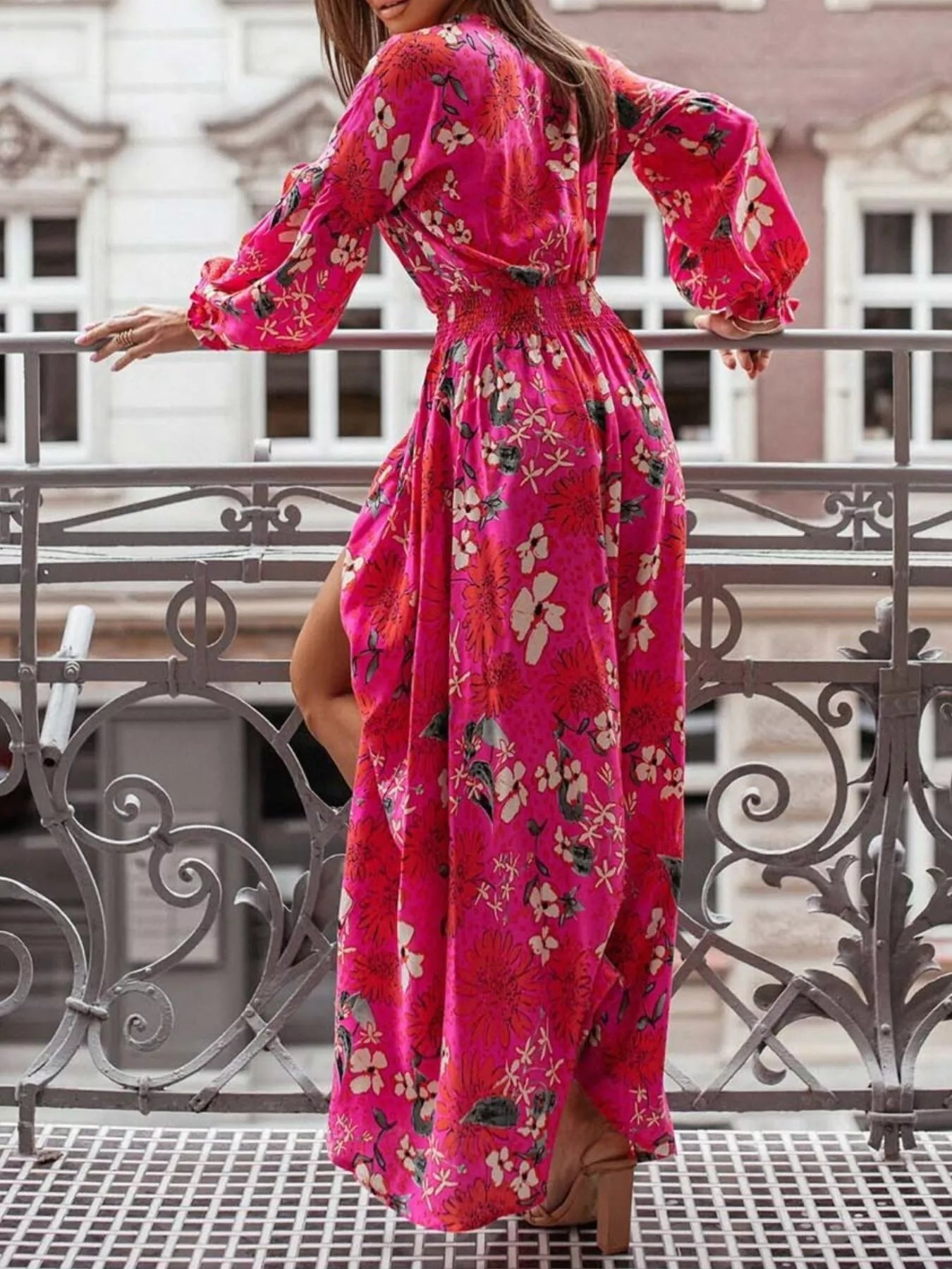 Bohemian floral printed maxi dress with plunging neckline, ruched waist, tiered skirt, and long flowy sleeves