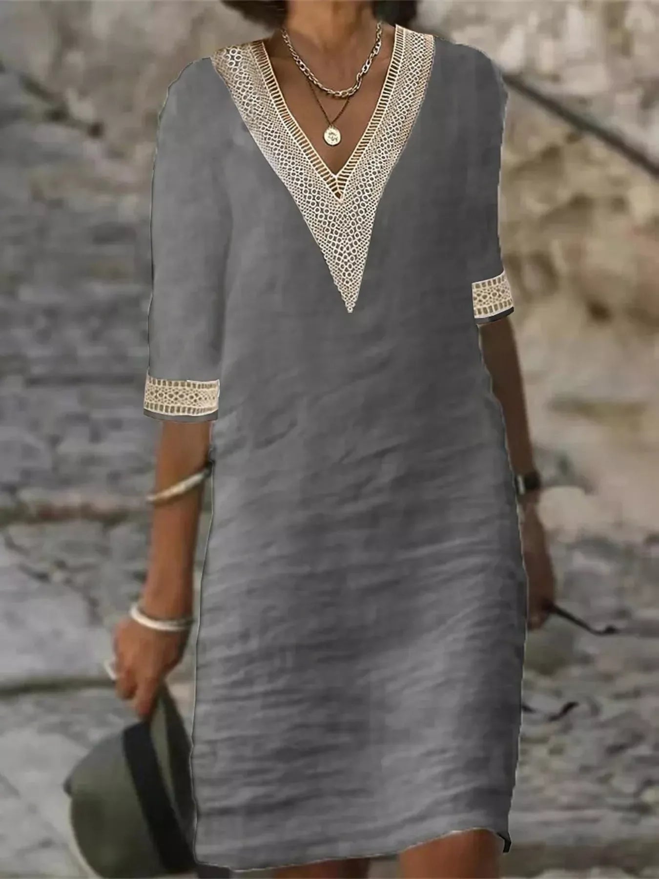 Plus-size white V-neck dress with lace trim and half sleeves