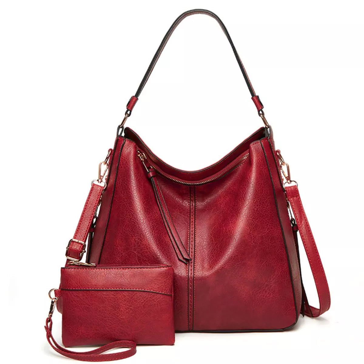 Burgundy PU leather crossbody bag with a slouchy hobo silhouette, top zipper, long adjustable strap, gold-tone hardware, and matching detachable pouch.