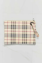 Cream, black, and pink plaid PU leather wristlet with a clean rectangular silhouette, zip-top closure, and attached wrist strap.