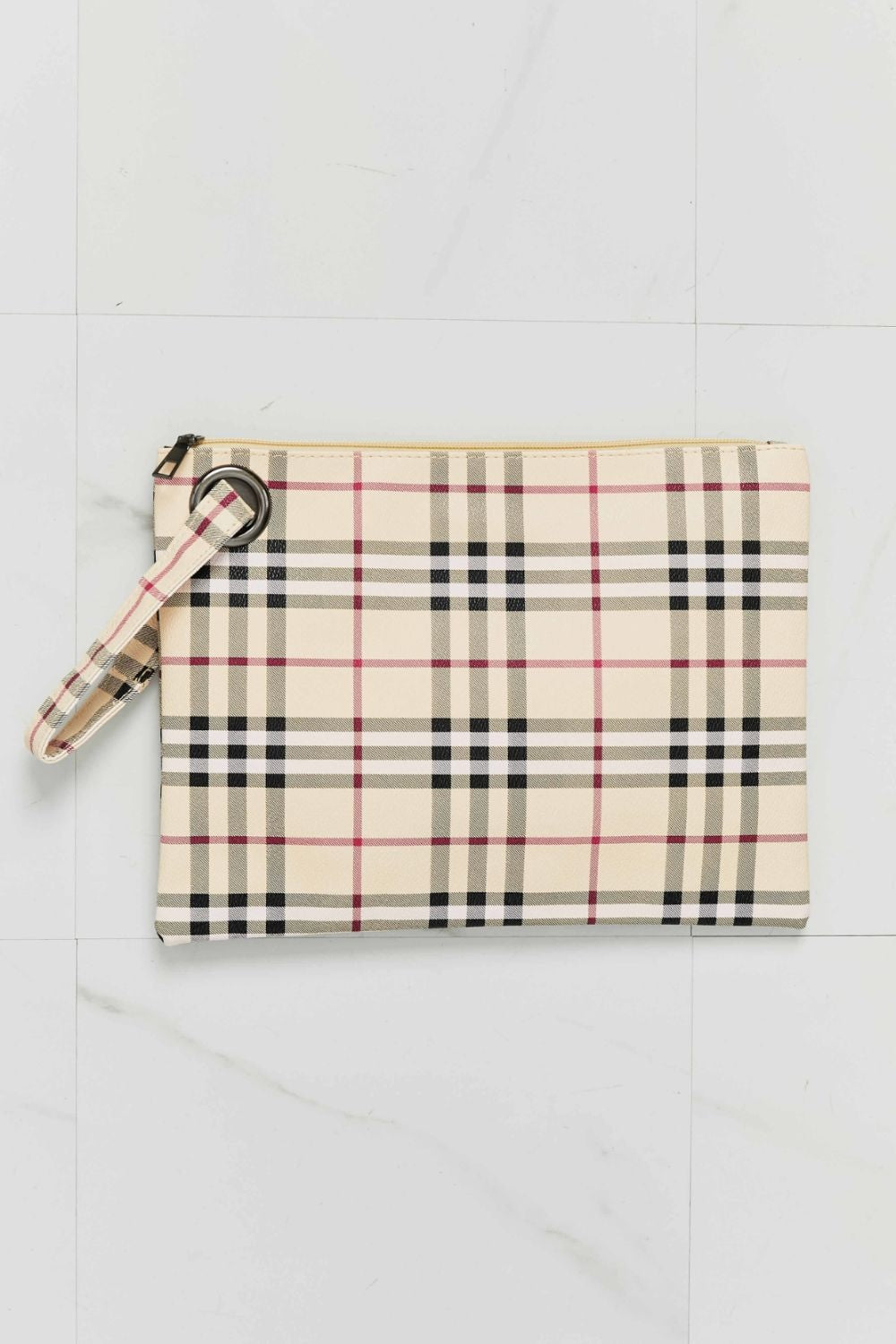 Cream, black, and pink plaid PU leather wristlet with a clean rectangular silhouette, top zipper, and detachable wrist strap.