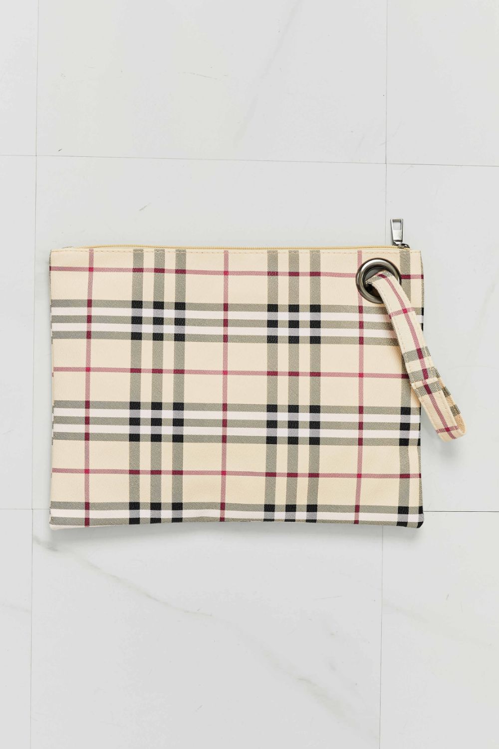 Cream, black, and pink plaid PU leather wristlet with a clean rectangular silhouette, zip-top closure, and attached wrist strap.