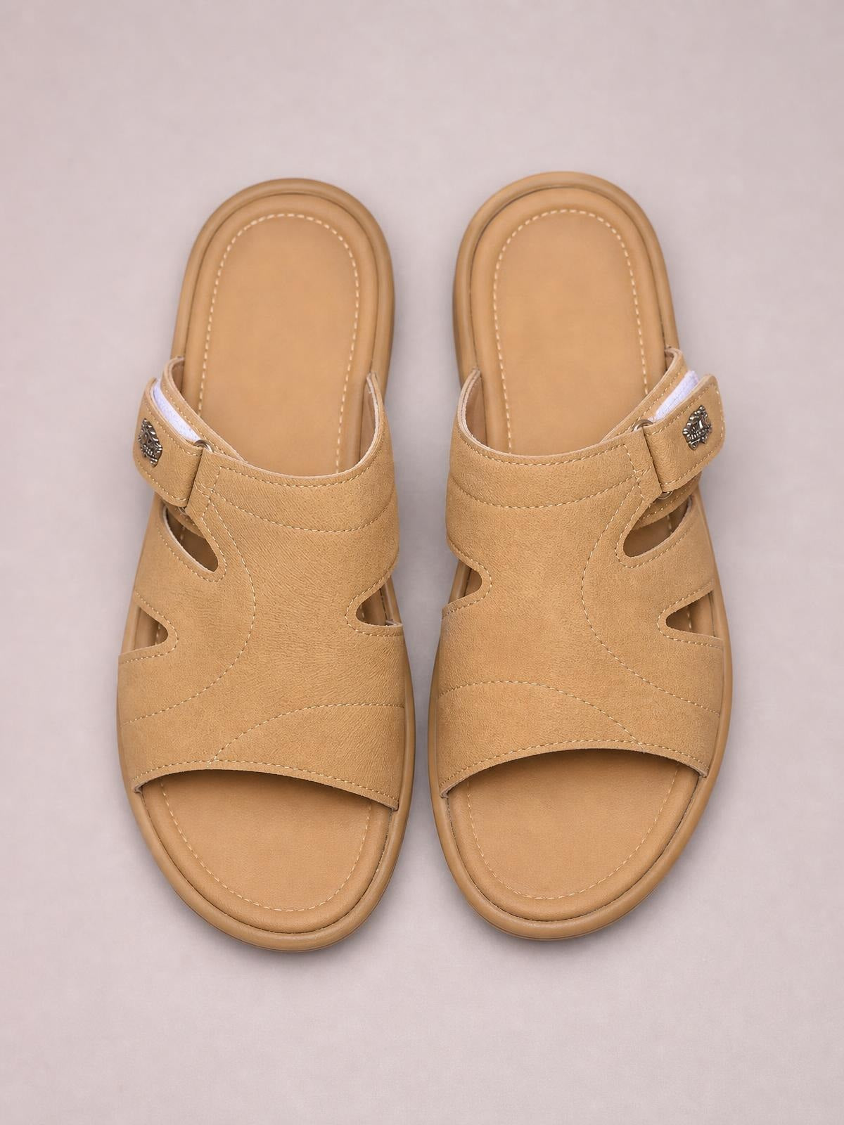 Tan PU leather cut-out platform slides feature stitched panels, decorative buckle straps, open toes, and cushioned flat soles for casual comfort.