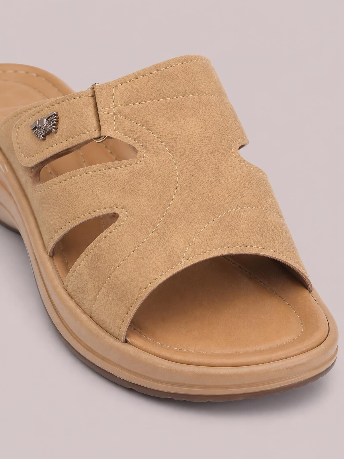 Tan PU leather cut-out platform slides feature wide stitched straps, an adjustable buckle, open toes, and a cushioned EVA flat sole.
