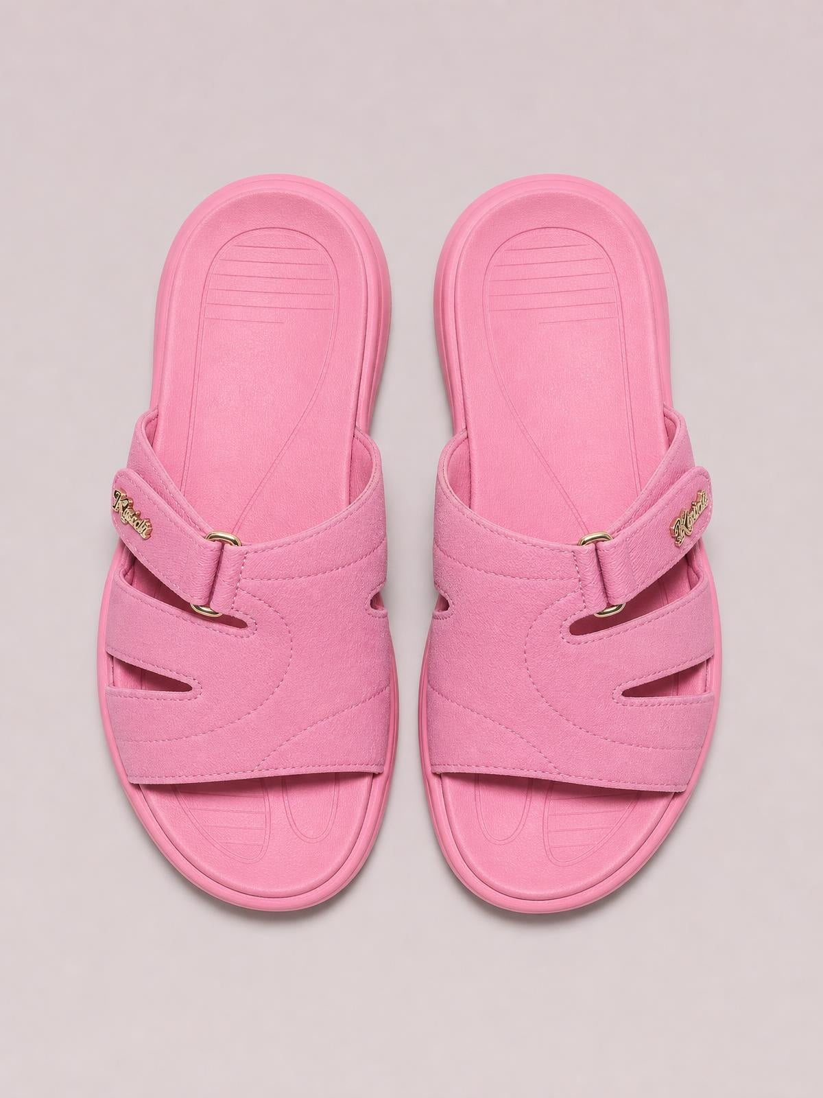 Pink casual comfort platform slides with layered cut-out straps, adjustable buckle closures, rounded open toes, and flat EVA soles.