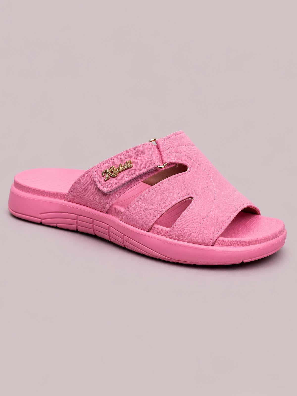 Bright pink casual comfort platform slides feature multiple cut-out straps, an adjustable hook-and-loop closure, open toes, and a flat grooved sole.