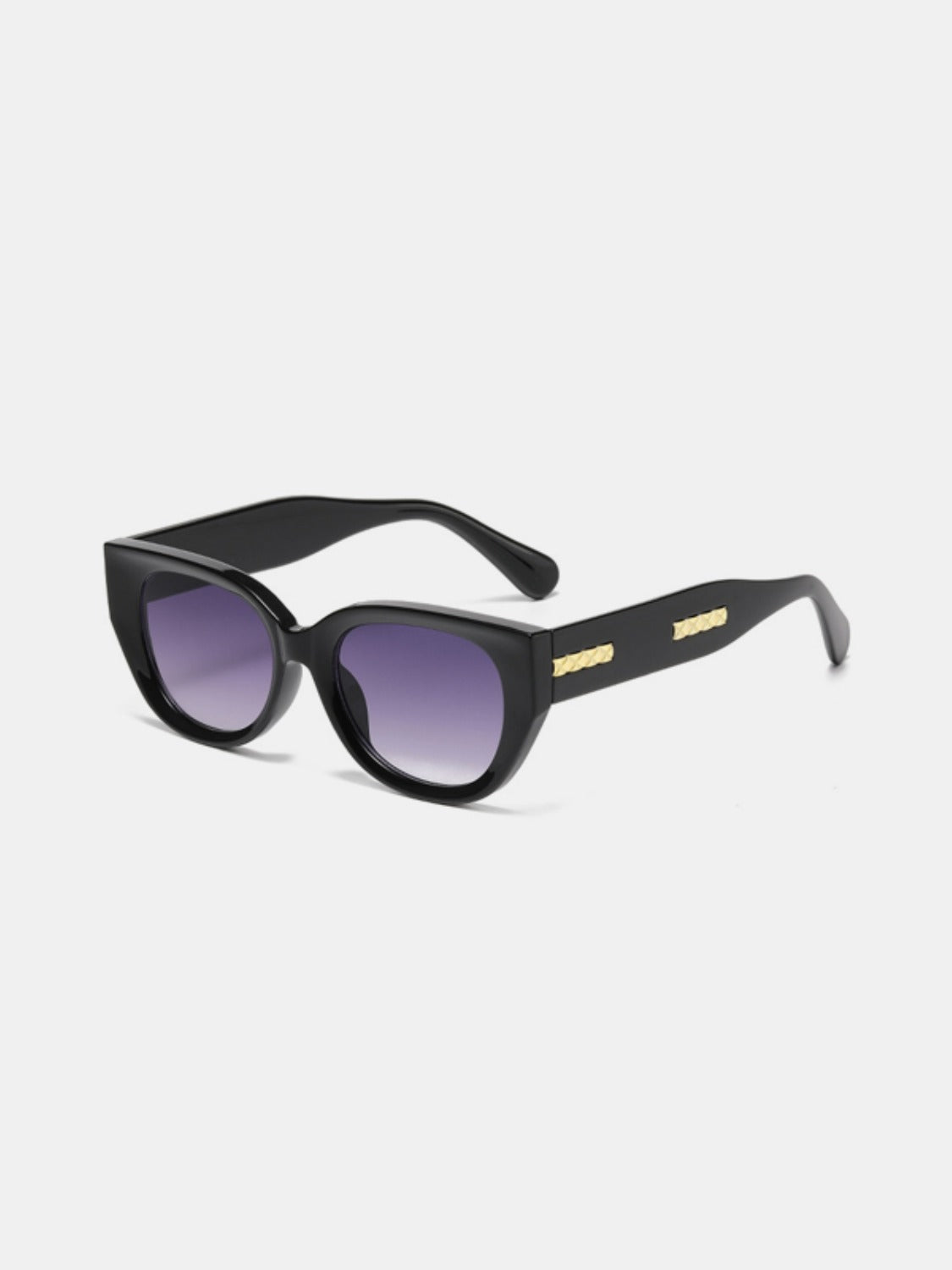 Black polycarbonate cat-eye sunglasses feature softly upswept corners, rounded purple gradient lenses, bold frames, sleek temples, and gold side detailing.