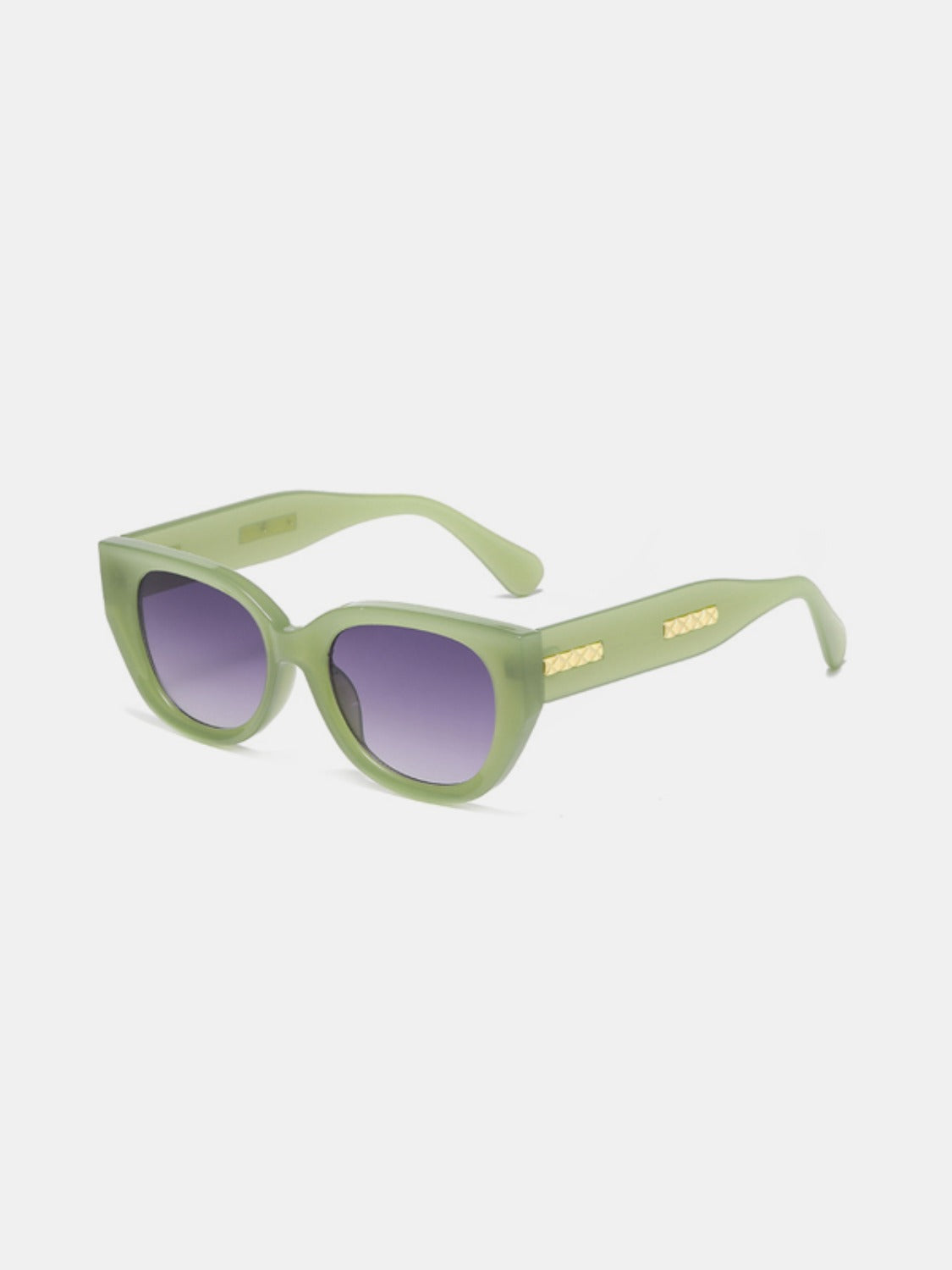 Green polycarbonate cat-eye sunglasses feature rounded purple gradient lenses, softly upswept corners, sleek temples, and subtle gold side detailing.
