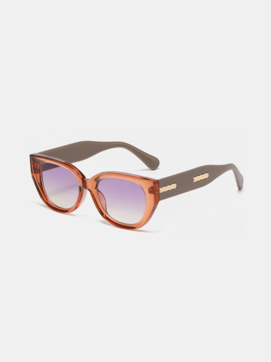 Amber-brown polycarbonate cat-eye sunglasses feature softly upswept corners, rounded purple gradient lenses, streamlined temples, and subtle gold side detailing.