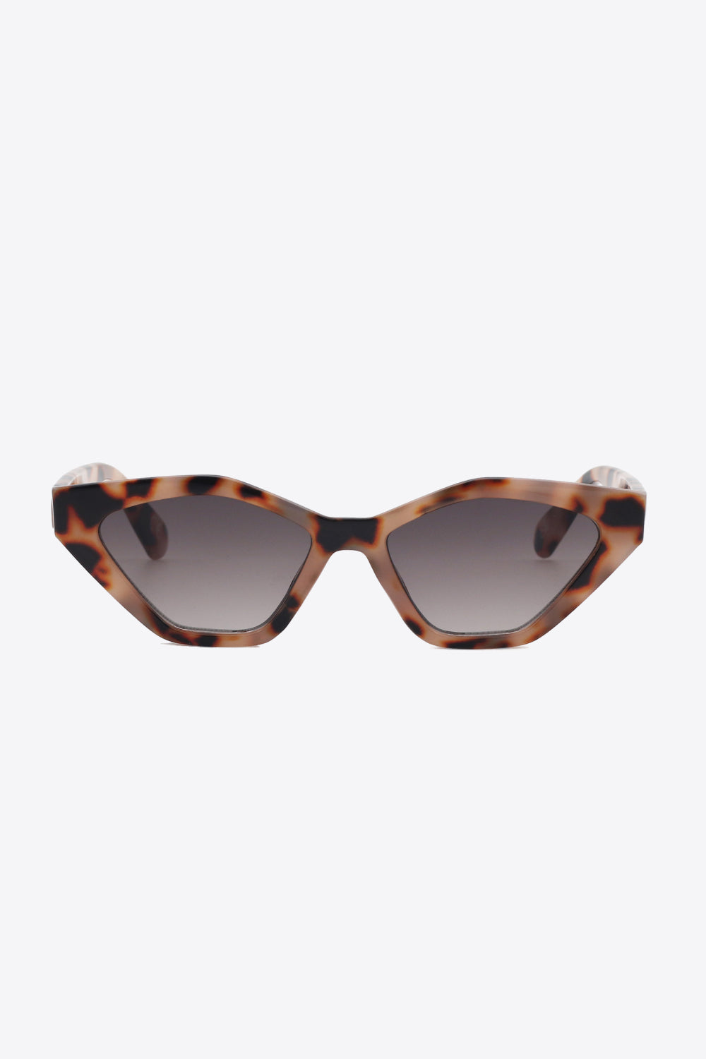Tortoiseshell polycarbonate cat-eye sunglasses feature angular lenses, lifted outer corners, a sculpted frame, and dark gradient lenses for a sleek statement look.