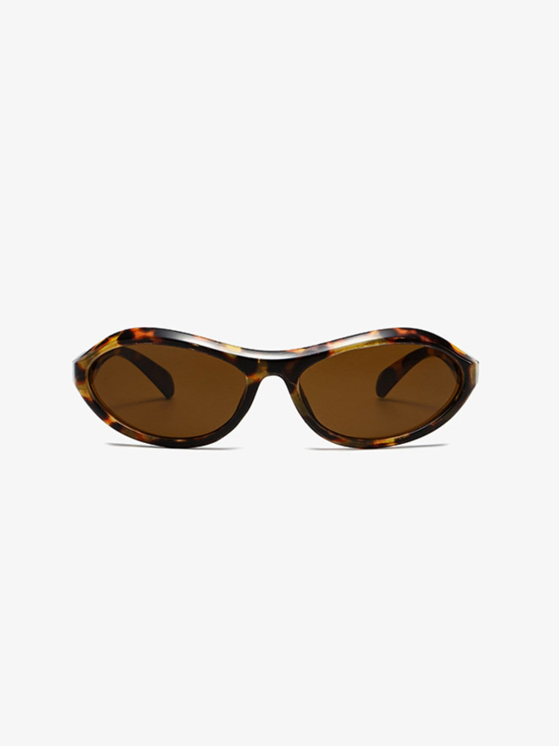 Tortoiseshell cat-eye sunglasses feature sculpted polycarbonate frames, warm brown lenses, and a sleek tapered silhouette with gently sweeping edges.