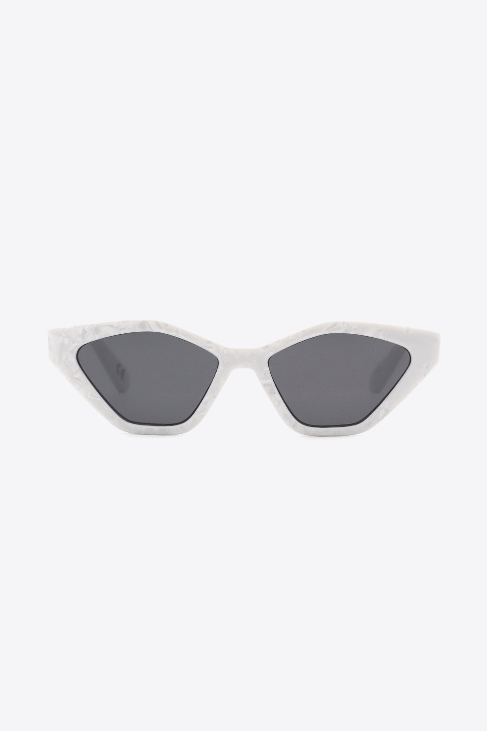 White polycarbonate cat-eye sunglasses feature dark lenses, angular frames, and sharply lifted outer corners for a sleek, sculpted silhouette.