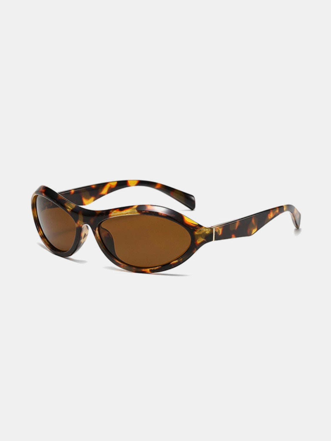 Tortoiseshell cat-eye sunglasses with brown lenses feature sculpted polycarbonate frames and temples, shown at an angled three-quarter view with the arms open.