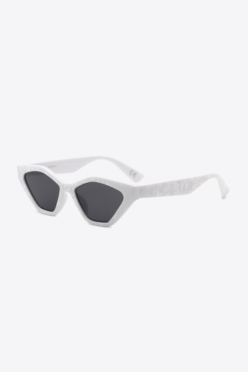 White polycarbonate cat-eye sunglasses feature dark angular lenses, lifted outer corners, and sculpted textured frames with streamlined temples.