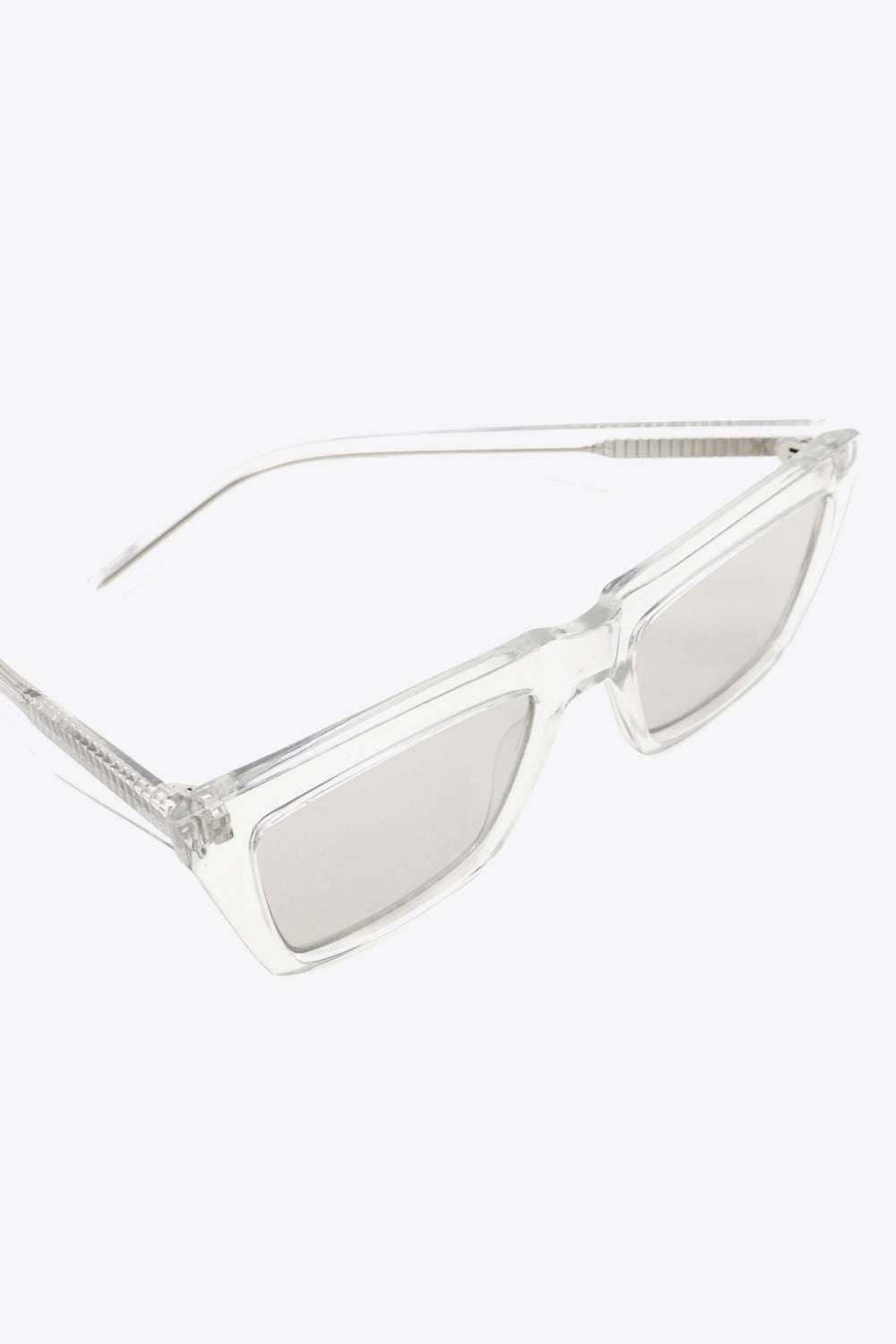 Light gray translucent rectangle sunglasses feature gently rounded corners, a structured cellulose propionate frame, matching temples, and coordinated acetate lenses.