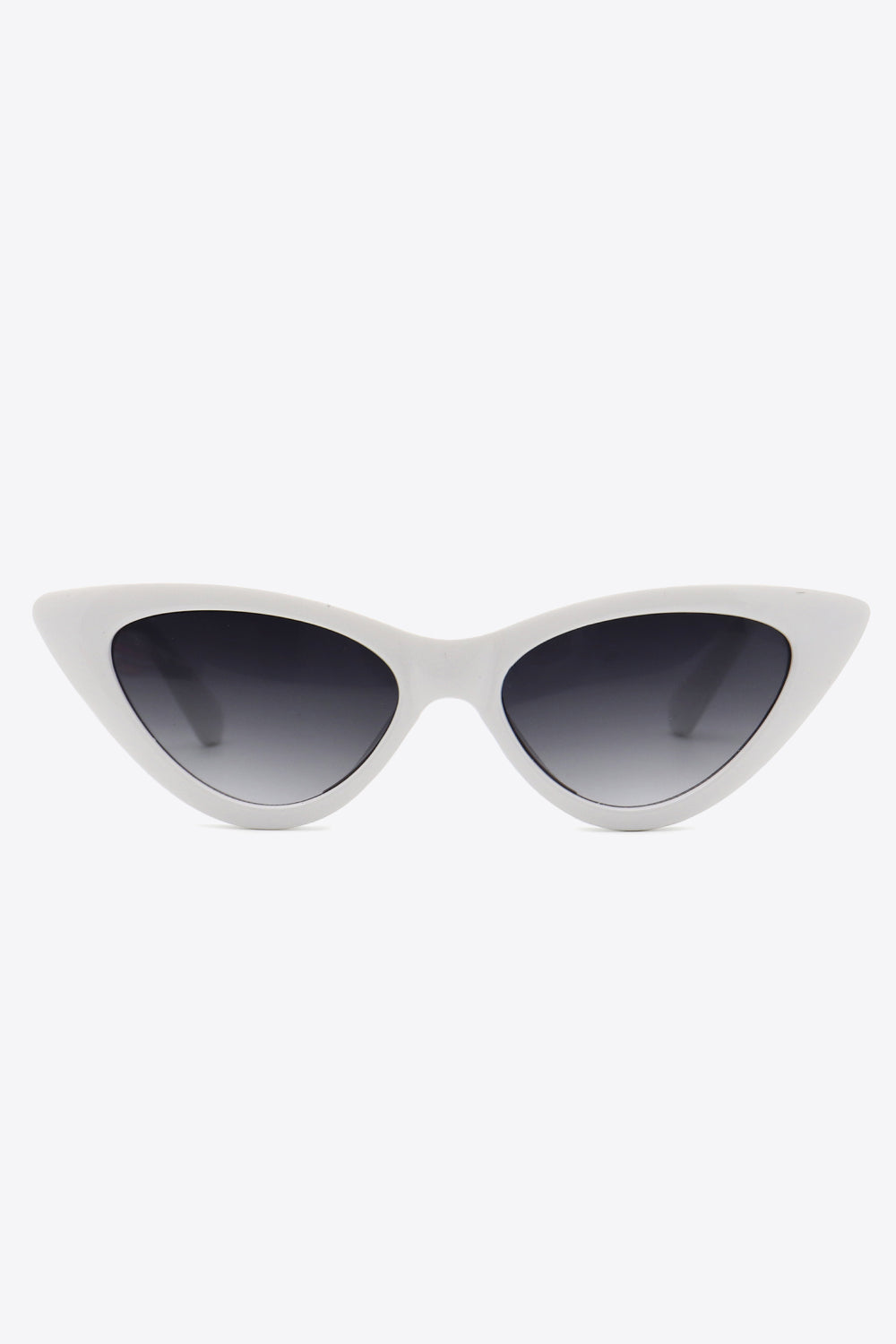 White cat-eye sunglasses feature a bold upswept frame, dark gradient lenses, and a sleek streamlined construction.