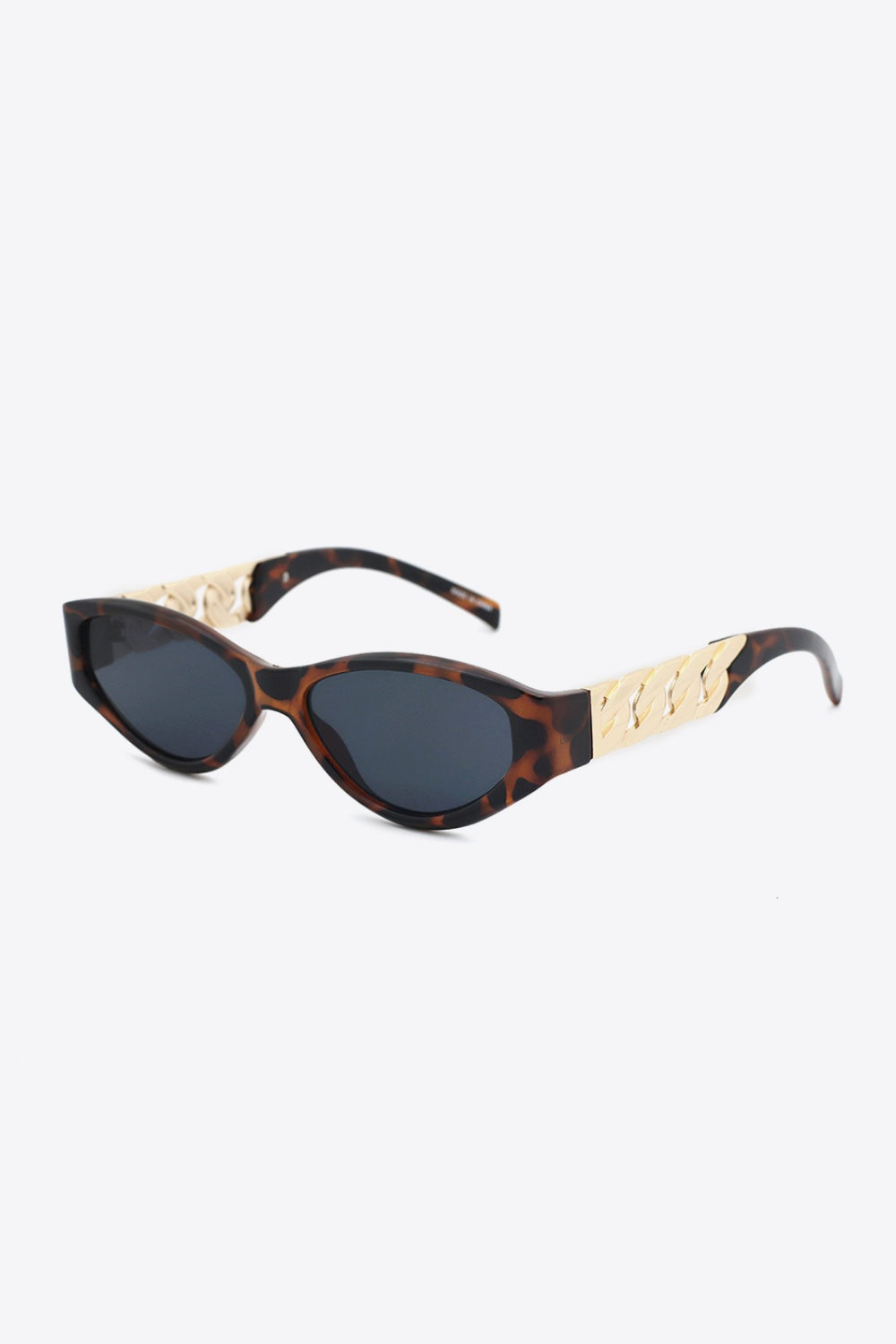 Tortoiseshell cat-eye sunglasses feature dark lenses, an upswept silhouette, and distinctive gold chain-inspired temple accents.