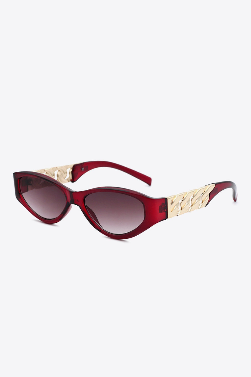 Burgundy cat-eye sunglasses feature gradient lenses, an upswept silhouette, and polished gold chain-inspired temple accents for a vintage-inspired statement.