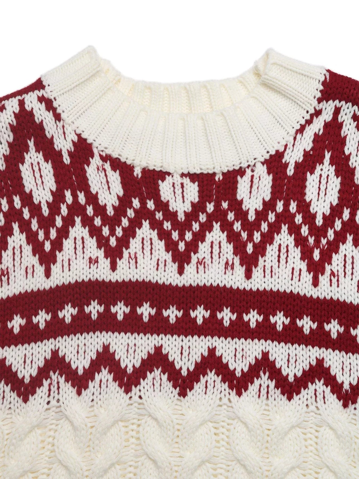 A red and cream Christmas cable knit sweater features a ribbed crew neckline and contrasting geometric Fair Isle-style patterns.