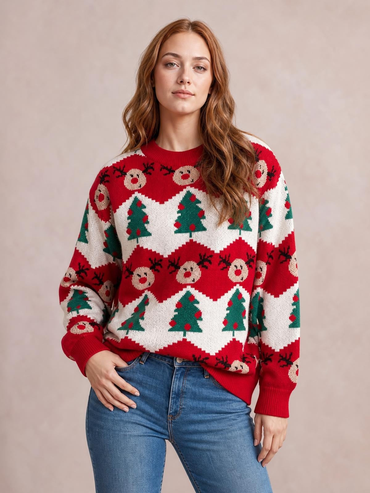 A model wears a red Christmas sweater with a round neck, long sleeves, reindeer and Christmas tree pattern, relaxed silhouette, and ribbed cuffs and hem.