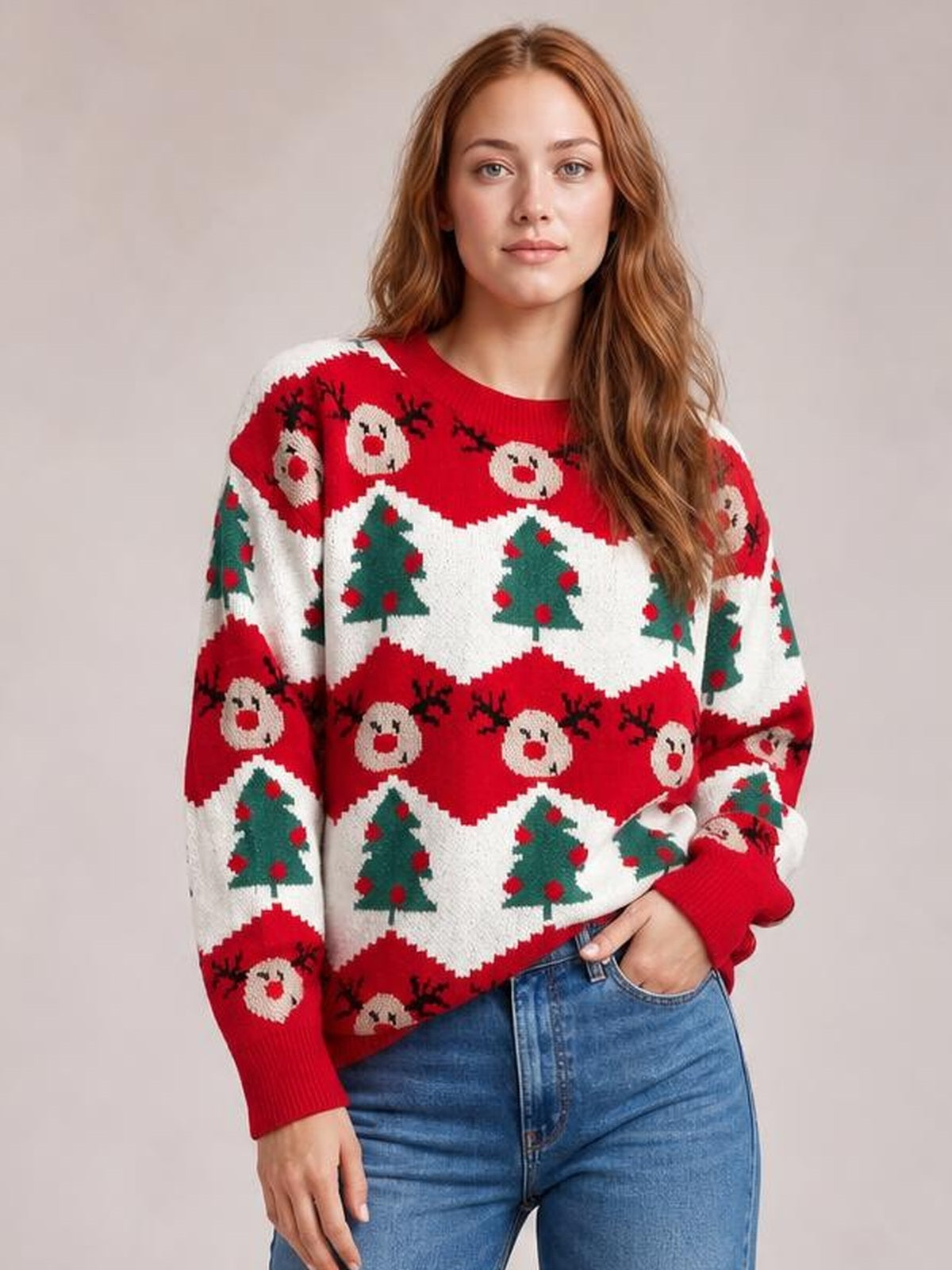 Model wearing a red Christmas sweater with a round neck, long sleeves, ribbed cuffs, and festive reindeer and Christmas tree patterns.