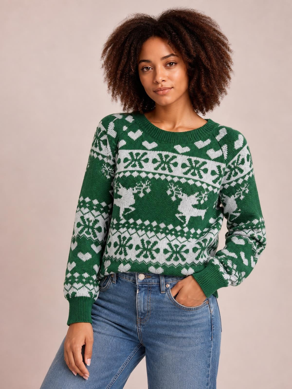 Model wears a green Christmas element sweater with a round neck, long sleeves, ribbed cuffs and hem, and a relaxed silhouette with white festive knit patterns.