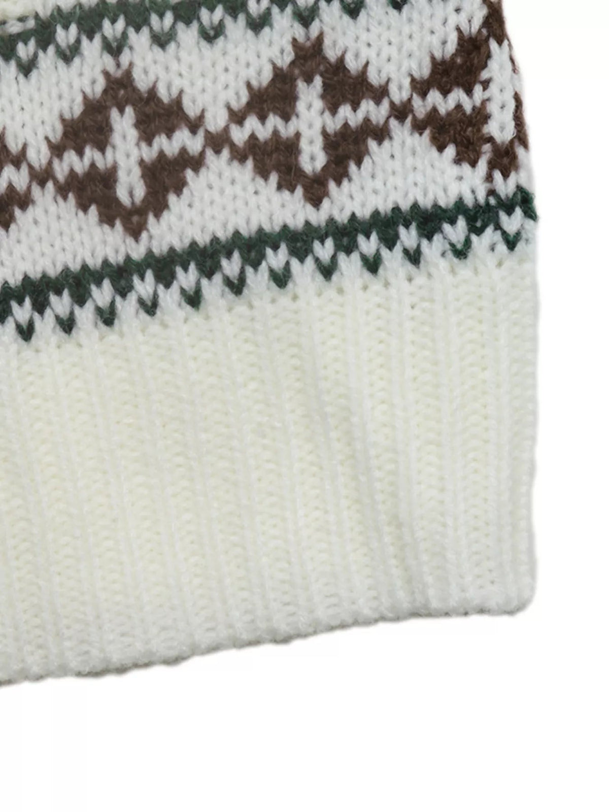 Close-up of a cream cable-knit sweater featuring brown reindeer motifs, dark green patterned bands, and a soft textured knit with a straight hem.