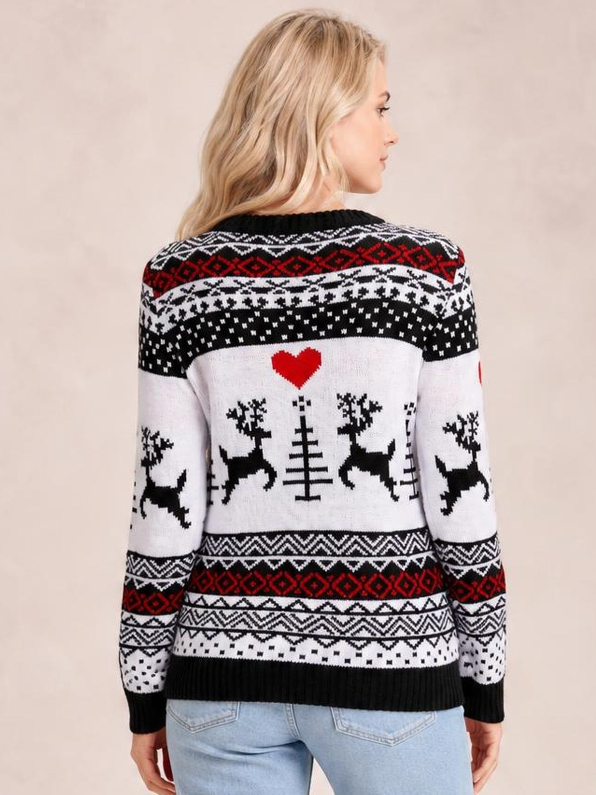 A woman models a Christmas round neck sweater from the back, featuring long sleeves, black, white and red reindeer patterns, geometric bands, and ribbed cuffs and hem.