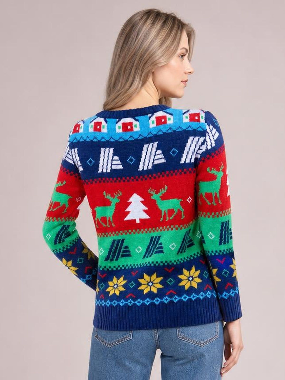 Model shown from the back in a colorful Christmas round neck sweater with long sleeves, ribbed trim, and festive reindeer, trees, and snowflake patterns.
