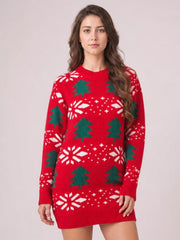 Model stands facing forward in a red Christmas Tree sweater dress with a round neck, long sleeves, ribbed cuffs and hem, and festive green and white motifs.