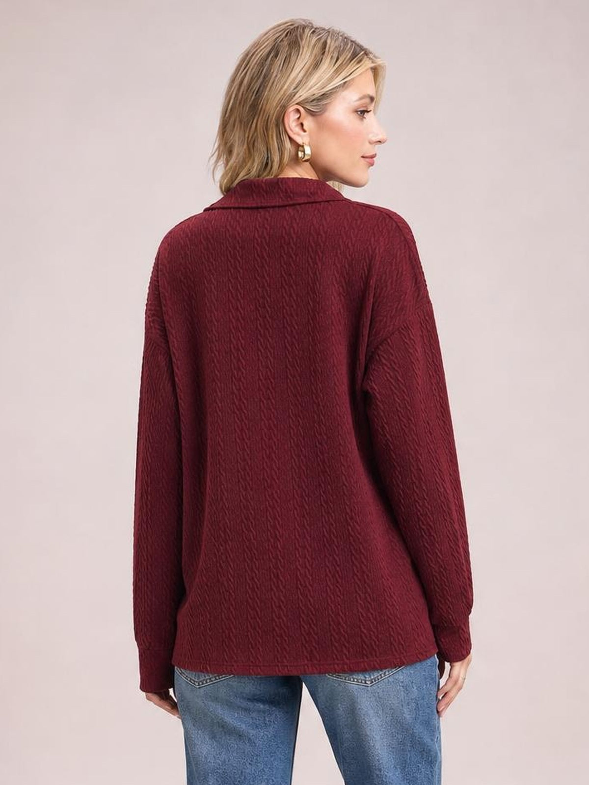 Model shown from the back wearing a burgundy collared neck blouse with long sleeves, textured construction, and a relaxed regular-length silhouette.