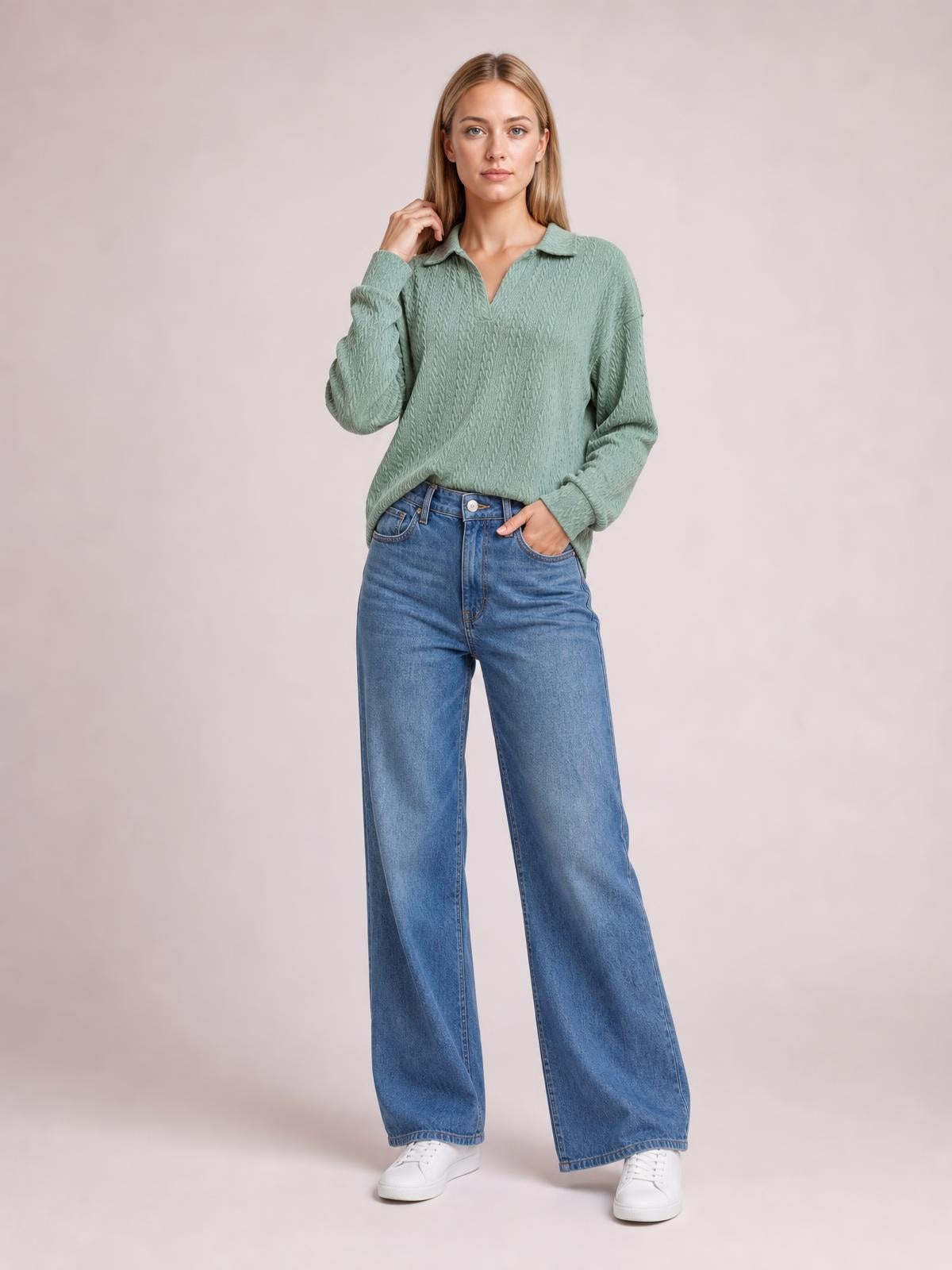 Model wears a sage green cable-knit blouse with a collared V-neck, long regular sleeves, and a relaxed regular-length silhouette.